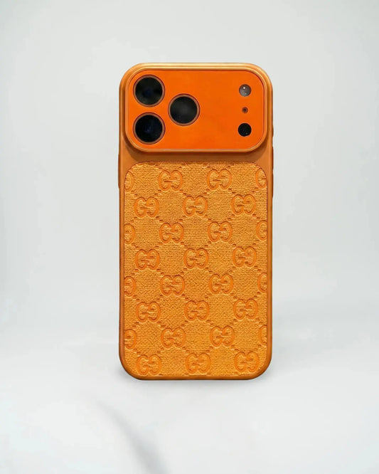 Orange phone case with Gucci logo pattern on a light gray background